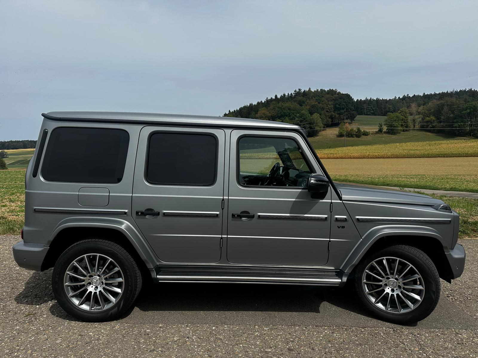 MERCEDES-BENZ MERCEDES-BENZ G 500 AMG Line 9G-Tronic – designo platin magno, 14'261 km, 1. Hand. 10 Jahre gratis Service - 100'000KM,-image-1
