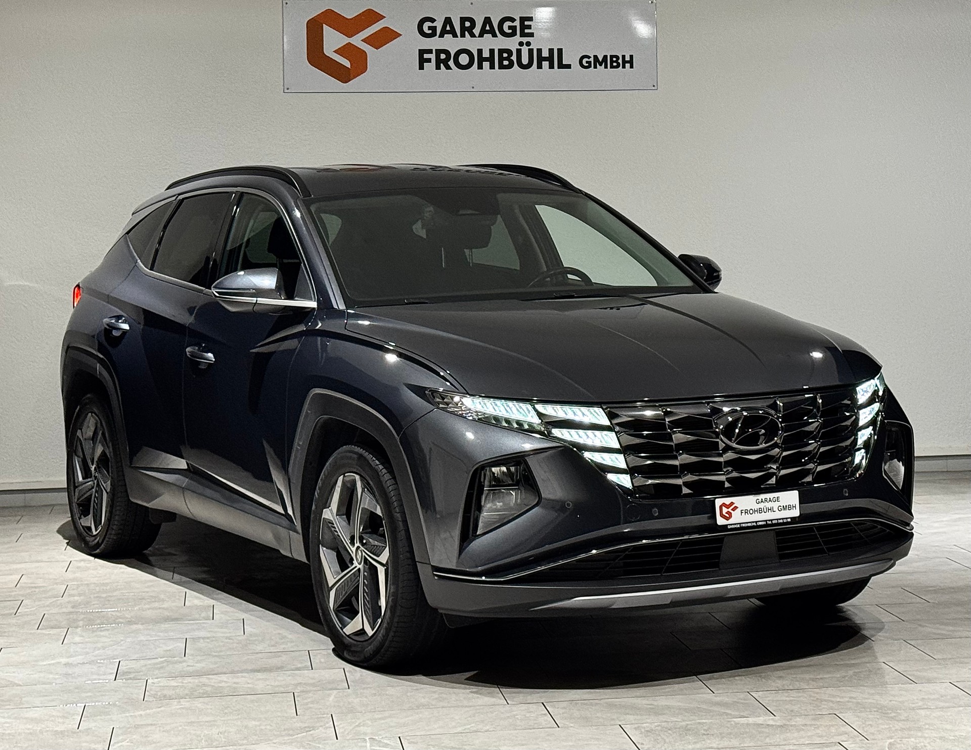 HYUNDAI Tucson 1.6 TGDI HEV Amplia 4WD | 1.Hand | CH |-showroom-element-2